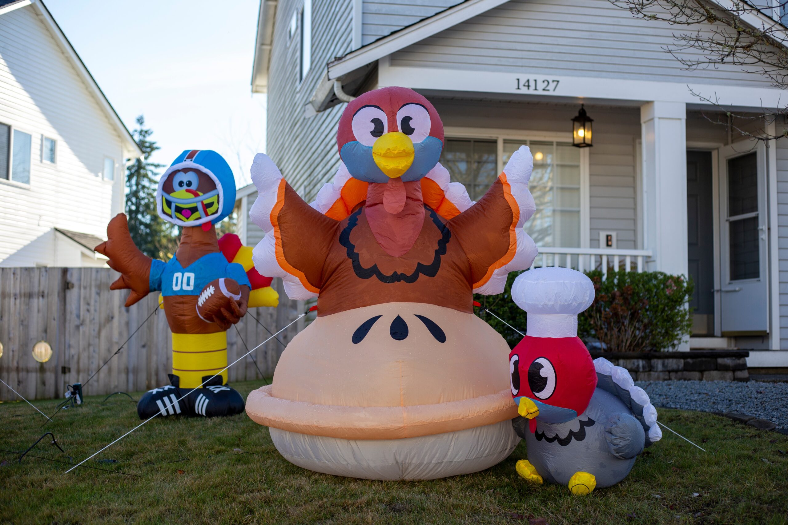 Thanksgiving Inflatable Yard Decorations with Safe Electrical Setup Outdoor Thanksgiving inflatable decorations plugged into exterior outlets, illustrating safe holiday electrical setup with weatherproof covers and GFCI protection for Minnesota homes.